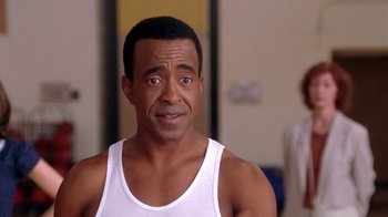 Movie still from “Mean Girls” (2004), directed by Mark Waters – A person wearing a tank top; Close Up shot, Over the shoulder angle