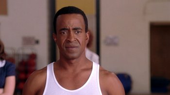 Movie still from “Mean Girls” (2004), directed by Mark Waters – A person wearing a tank top; Close Up shot, Over the shoulder angle