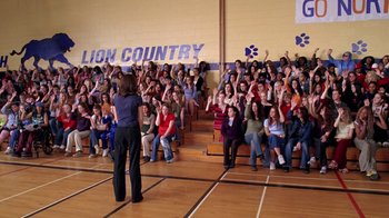 Movie still from “Mean Girls” (2004), directed by Mark Waters – A crowd of people sitting in front of an audience in a gym; Extreme Wide shot, High angle