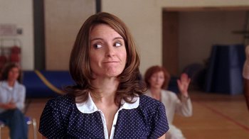 Movie still from “Mean Girls” (2004), directed by Mark Waters – A woman with a surprised look on her face; Close Up shot, Over the shoulder angle