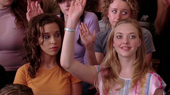 Movie still from “Mean Girls” (2004), directed by Mark Waters – A group of people sitting in a room; Medium shot, High angle