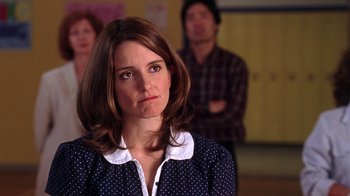 Movie still from “Mean Girls” (2004), directed by Mark Waters – A person wearing a polka dot shirt; Close Up shot, Over the shoulder angle