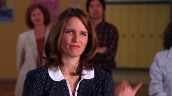 Movie still from “Mean Girls” (2004), directed by Mark Waters – A person wearing a polka dot shirt; Close Up shot, Over the shoulder angle