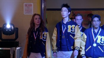 Movie still from “Mean Girls” (2004), directed by Mark Waters – A group of young people standing next to each other; Medium shot, Low angle