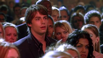 Movie still from “Mean Girls” (2004), directed by Mark Waters – A crowd of people standing in a room; Close Up shot, High angle