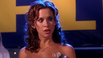 Movie still from “Mean Girls” (2004), directed by Mark Waters – A beautiful woman with long curly brown hair; Close Up shot, Over the shoulder angle