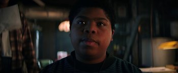 Movie still from “Fear Street: Part One - 1994” (2021), directed by Leigh Janiak – A person wearing a black shirt; Close Up shot, Low angle