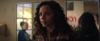 Movie still from “Fear Street: Part One - 1994” (2021), directed by Leigh Janiak – A person wearing a plaid shirt; Close Up shot, Over the shoulder angle