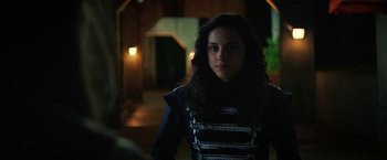 Movie still from “Fear Street: Part One - 1994” (2021), directed by Leigh Janiak – A young woman in a black and white outfit; Close Up shot, Over the shoulder angle