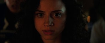 Movie still from “Fear Street: Part One - 1994” (2021), directed by Leigh Janiak – A woman's face in the dark; Close Up shot, Low angle