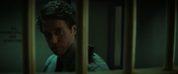 Movie still from “Fear Street: Part One - 1994” (2021), directed by Leigh Janiak – A man looking into a mirror while wearing a tie; Close Up shot, Low angle