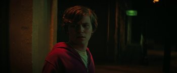 Movie still from “Fear Street: Part One - 1994” (2021), directed by Leigh Janiak – A young man in a red jacket is looking at the camera; Close Up shot, Over the shoulder angle