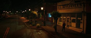 Movie still from “Fear Street: Part One - 1994” (2021), directed by Leigh Janiak – Two people walking down a street at night; Extreme Wide shot, High angle