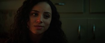 Movie still from “Fear Street: Part One - 1994” (2021), directed by Leigh Janiak – A woman's face in the dark; Close Up shot, Over the shoulder angle