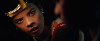 Movie still from “Fear Street: Part One - 1994” (2021), directed by Leigh Janiak – A person's face in the dark; Close Up shot, Over the shoulder angle