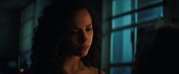 Movie still from “Fear Street: Part One - 1994” (2021), directed by Leigh Janiak – A person looking sad in the dark; Close Up shot, Low angle