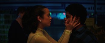 Movie still from “Fear Street: Part One - 1994” (2021), directed by Leigh Janiak – A young man and a young woman touching each other's face; Close Up shot, Low angle