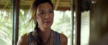 Movie still from “Mechanic: Resurrection” (2016), directed by Dennis Gansel – A person wearing a necklace; Close Up shot, Over the shoulder angle