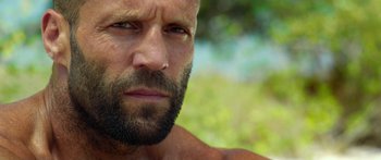Movie still from “Mechanic: Resurrection” (2016), directed by Dennis Gansel – A person with a beard; Close Up shot, Low angle