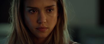 Movie still from “Mechanic: Resurrection” (2016), directed by Dennis Gansel – A woman's face in a dark room; Close Up shot, Over the shoulder angle