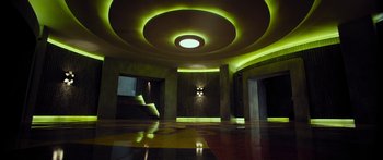 Movie still from “Mechanic: Resurrection” (2016), directed by Dennis Gansel – A room that has some lights in the ceiling; Extreme Wide shot, Low angle