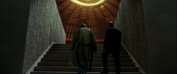 Movie still from “Mechanic: Resurrection” (2016), directed by Dennis Gansel – Two men walking up a set of stairs; Wide shot, Low angle