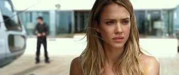 Movie still from “Mechanic: Resurrection” (2016), directed by Dennis Gansel – A person with long blonde hair; Close Up shot, Over the shoulder angle