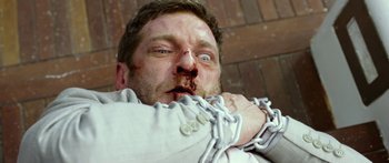 Movie still from “Mechanic: Resurrection” (2016), directed by Dennis Gansel – A person tied up with chains; Close Up shot, Overhead angle