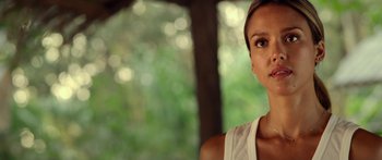 Movie still from “Mechanic: Resurrection” (2016), directed by Dennis Gansel – A person looking at the camera; Close Up shot, Over the shoulder angle