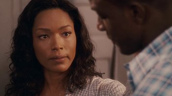 Movie still from “Meet the Browns” (2008), directed by Tyler Perry – A woman and a man looking at one another; Close Up shot, Over the shoulder angle