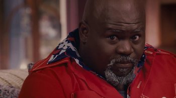 Movie still from “Meet the Browns” (2008), directed by Tyler Perry – A man with a beard and a red jacket; Close Up shot, Low angle