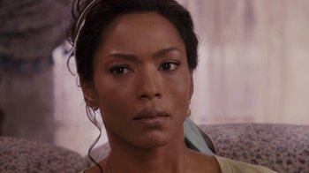 Movie still from “Meet the Browns” (2008), directed by Tyler Perry – A person wearing a necklace; Close Up shot, Over the shoulder angle