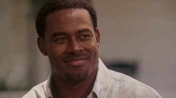 Movie still from “Meet the Browns” (2008), directed by Tyler Perry – A person wearing a shirt; Close Up shot, Over the shoulder angle