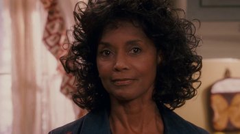 Movie still from “Meet the Browns” (2008), directed by Tyler Perry – A person with curly hair; Close Up shot, Over the shoulder angle