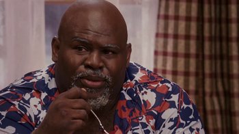Movie still from “Meet the Browns” (2008), directed by Tyler Perry – An older man with a beard is holding his mouth open; Close Up shot, High angle