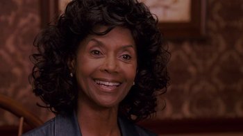 Movie still from “Meet the Browns” (2008), directed by Tyler Perry – An older woman smiling for the camera; Close Up shot, Over the shoulder angle