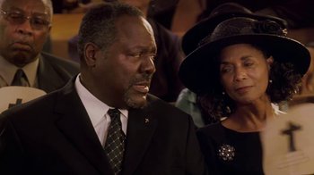 Movie still from “Meet the Browns” (2008), directed by Tyler Perry – A man and a woman wearing suits and hats; Close Up shot, Over the shoulder angle