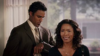 Movie still from “Meet the Browns” (2008), directed by Tyler Perry – A man and a woman are looking at each other; Medium shot, Over the shoulder angle