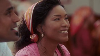 Movie still from “Meet the Browns” (2008), directed by Tyler Perry – A woman wearing a pink sweater and a pink scarf; Close Up shot, Over the shoulder angle