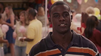 Movie still from “Meet the Browns” (2008), directed by Tyler Perry – A person wearing a striped shirt; Close Up shot, Over the shoulder angle