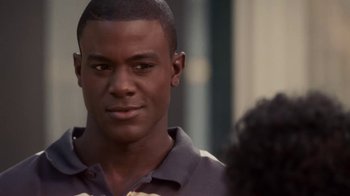 Movie still from “Meet the Browns” (2008), directed by Tyler Perry – A person wearing a polo shirt; Close Up shot, Over the shoulder angle