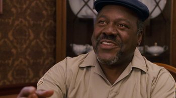 Movie still from “Meet the Browns” (2008), directed by Tyler Perry – An older man wearing a hat smiling for the camera; Close Up shot, Low angle