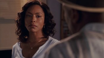 Movie still from “Meet the Browns” (2008), directed by Tyler Perry – A woman that is looking at a man; Close Up shot, Over the shoulder angle