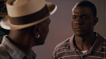 Movie still from “Meet the Browns” (2008), directed by Tyler Perry – A man and a woman are talking to each other; Close Up shot, Over the shoulder angle