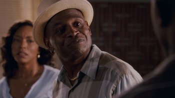 Movie still from “Meet the Browns” (2008), directed by Tyler Perry – A person wearing a hat; Close Up shot, Over the shoulder angle