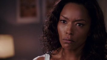 Movie still from “Meet the Browns” (2008), directed by Tyler Perry – A person with long black curly hair; Close Up shot, Over the shoulder angle