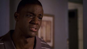Movie still from “Meet the Browns” (2008), directed by Tyler Perry – A person with his eyes wide open; Close Up shot, High angle
