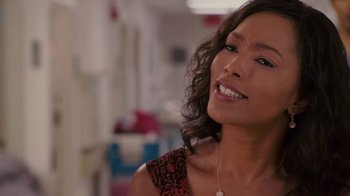 Movie still from “Meet the Browns” (2008), directed by Tyler Perry – A person wearing a necklace; Close Up shot, Over the shoulder angle