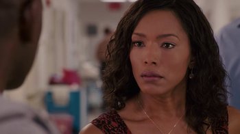 Movie still from “Meet the Browns” (2008), directed by Tyler Perry – A person wearing a necklace; Close Up shot, Over the shoulder angle