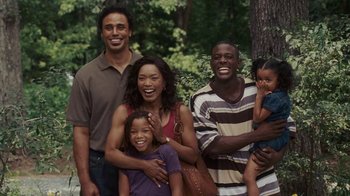 Movie still from “Meet the Browns” (2008), directed by Tyler Perry – A group of people standing next to each other in front of a tree; Medium shot, High angle
